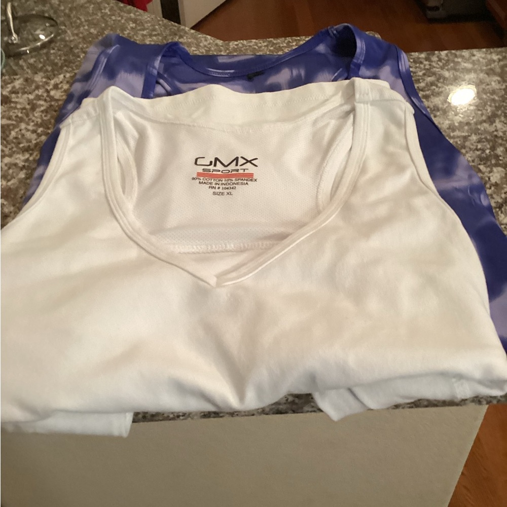2 tank tops one white and one purple.